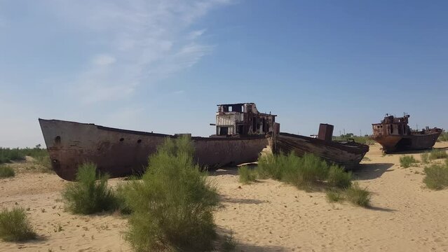 Rusty Abandoned Ships and Boats in Decay in Sand of Former Aral Sea, Central Asia, Apocalyptic Scenery, Panorama