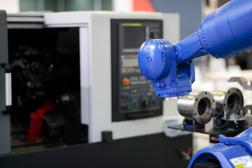 robot and the CNC lathe machine