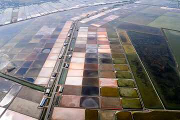 Aerial drone photo of colourful salt flats textures in Phetchaburi, Thailand