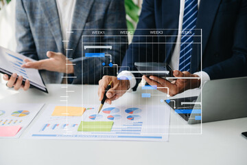 Project manager working and update tasks with milestones progress planning and Gantt chart...