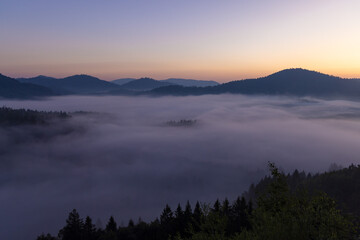 Dawn with golden morning mist in a mountain valley, Croatia