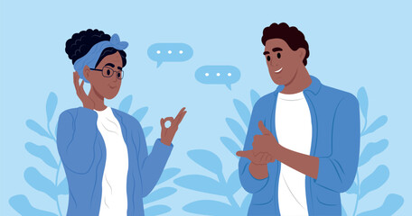 International day of sign languages. A pair of elderly deaf and mute people using sign language to communicate. A man and a woman with hearing impairment. © Nadiia