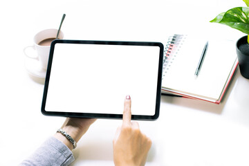 Woman hoilding blank screen tablet finger touching on white screen. Empty white screen for copy space and advertising text.