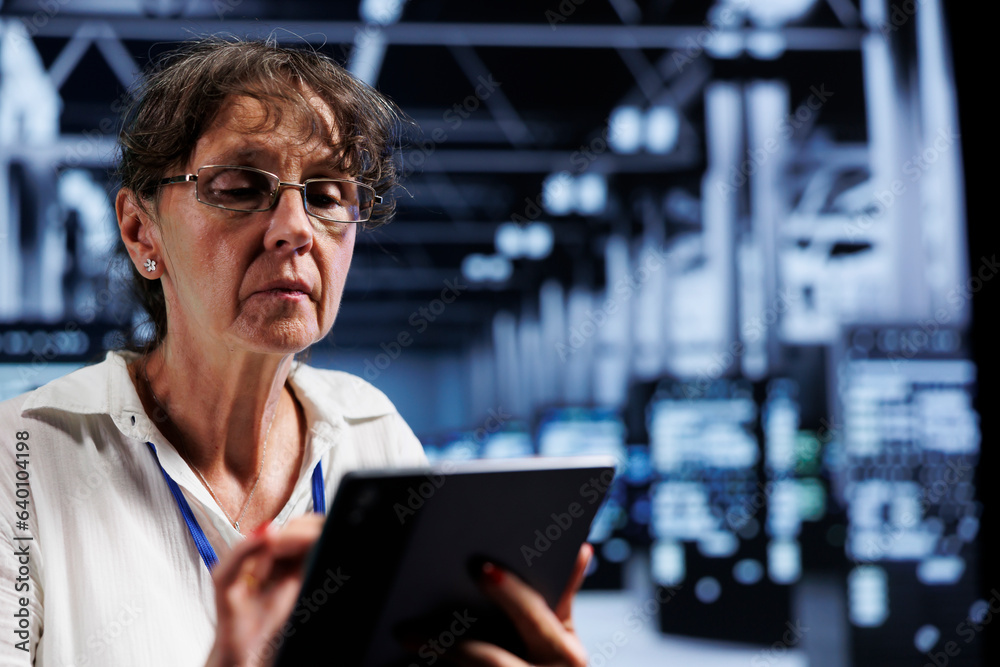 Poster elderly it programmer using tablet to assess server cybersecurity dangers arising due to unsecured n