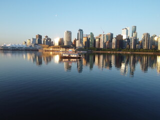 aerial view of downtown Vancouver during sunrise with the skyscrapers and the reflection of the sun...