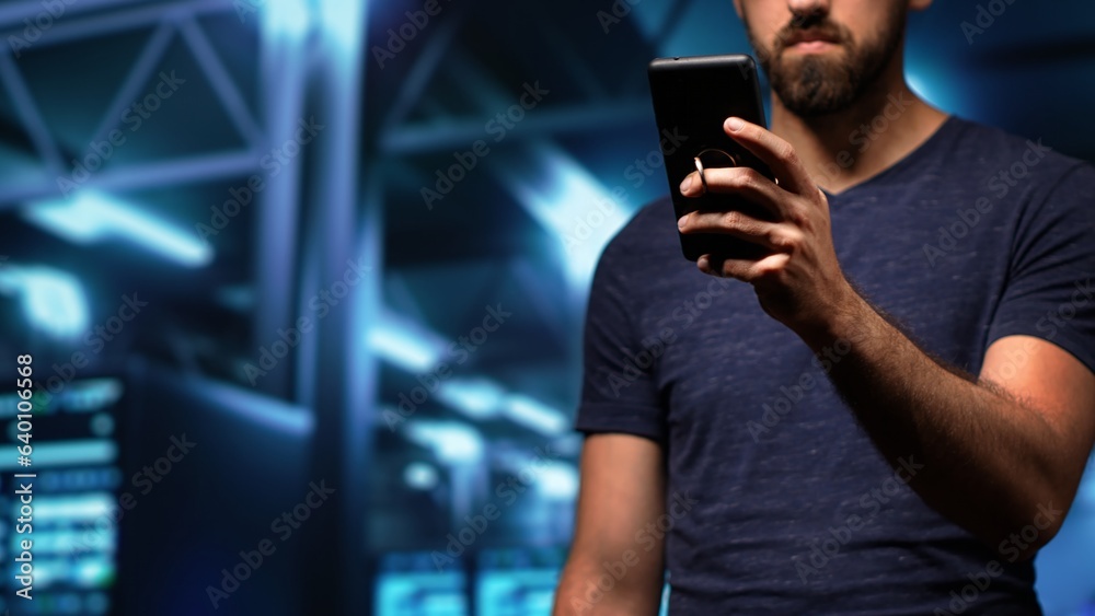 Poster man engineer working in server room using phone to check tech processing software for database safet