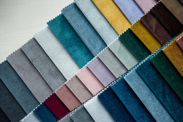 Catalog of new upholstery fabric samples on home sofa or renovation other