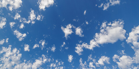 Bright blue sky with clouds and sun reflection. Sun shines bright in daytime in summer panoramic abstract nature. Environment Earth. Skyscape, cloudscape. Happy relaxing meditation inspire skyline