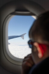 Fototapeta na wymiar looking out of airplane in the sky