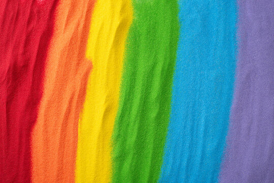 Sand flag embodies LGBT history month support. Top view displays a rainbow sand flag, including an open space for empowering and affirming words