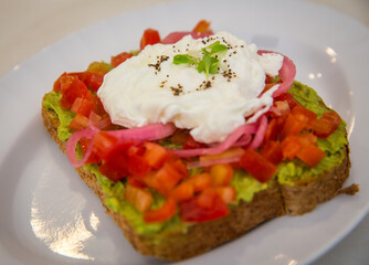 Smashed avocado toast with eggs