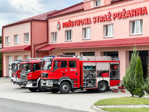 Chelm, Poland, July 21, 2023: Fire Brigade cars in Chełm standing in front of the fire station with partially visible equipment.