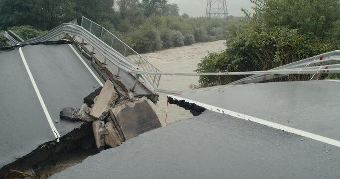 Collapsed broken road bridge severe catastrophic river water floods