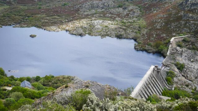 Vega de tera reservoir zamora spain, panoramic pan across water establishing