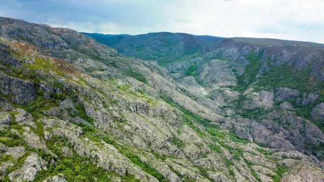 Rio tera canyon and winding green bands move across mountainous terrain