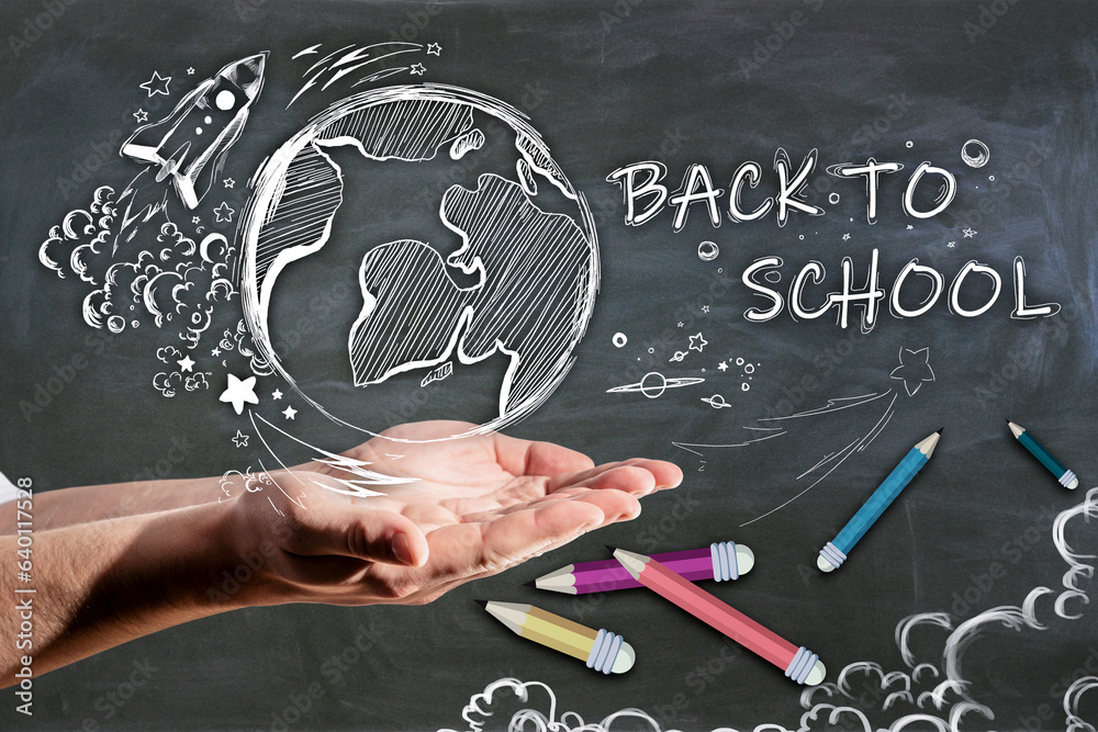 Poster close up of man hand holding abstract back to school sketch with pencils and rocket on chalkboard wa