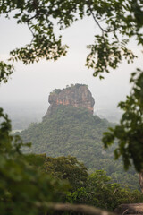Hazy and moody morning photo of Sigiriya Lion Rock from Pidarangula Rock