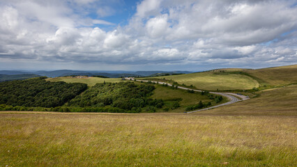 Views with winding roads through the hills and mountains in the French region of Haut-rhin de Vosges.