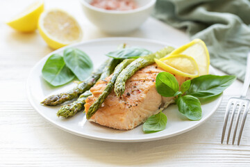 Baked Delicious salmon, green asparagus on  plate