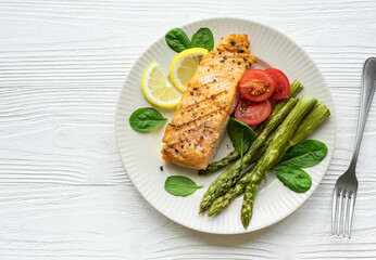 Baked Delicious salmon, green asparagus on  plate