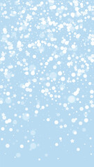 Snowfall overlay christmas background. Subtle flying snow flakes and stars on light blue winter backdrop. Festive snowfall overlay. Vertical vector illustration.