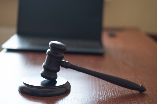 judge's gavel and computer. cyber crimes. the court restricts activities on the Internet.