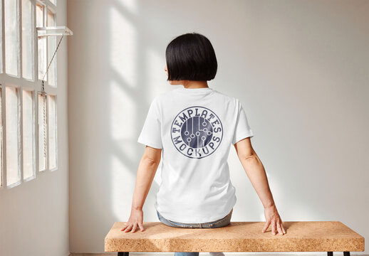Mockup of woman wearing t-shirt with customizable color, rear view