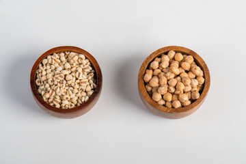 Flat lay pile of Job's tears ( Adlay millet) and Heap of Job's tears in a basket wooden on white background