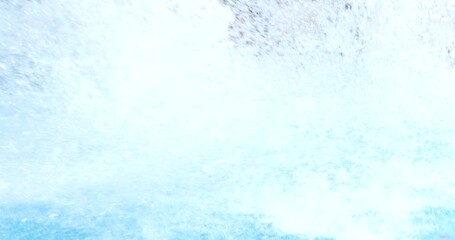 Man on slide in water park in summer in hotel. Summer vacation and entertainment for tourists