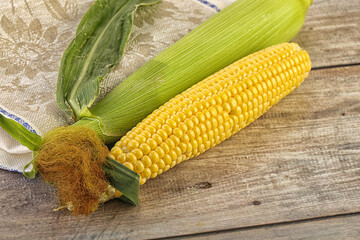 Yellow sweet raw cob corn