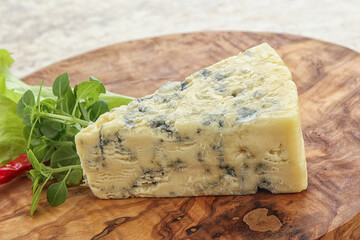 Blue cheese piece over board