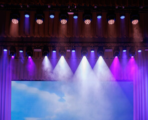 scene, stage light with colored spotlights and smoke