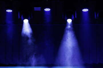 scene, stage light with colored spotlights and smoke