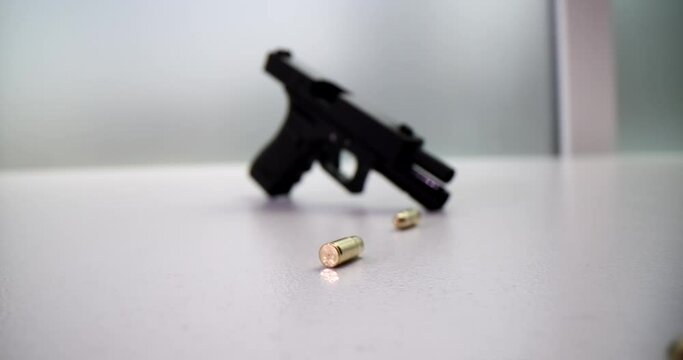 9mm pistol bullets and black pistol. Deadly weapon