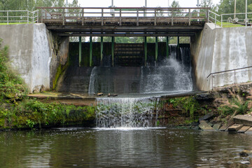 a natural waterfall over the dolomite outcrop on which a hydro electrtra station is installed.