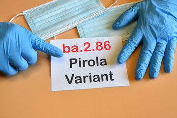 Doctor's hand indicate white sheet with text " ba.2.86 Pirola Variant". Concept of medical variety Pirola Variant and COVID-19. COVID-19 ba.2.86 Pirola Variant concept.