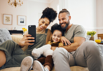 Interracial parents, child and selfie on sofa, smile and hug for love, bonding and memory on web...