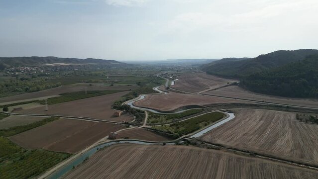 Aerial view of an irrigation channel placed across fields.