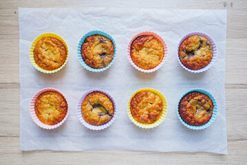 Delicious freshly baked gluten free berry muffins made with coconut flour with no added sugar, top view. Healthy sweet food, flat lay style.