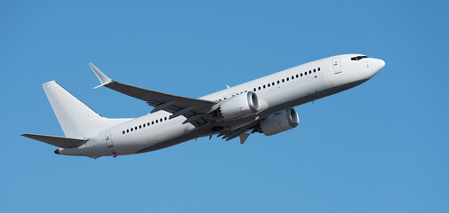 Airplane take off on the blue sky, Aircraft flying on sky background. White passenger jet plane in...