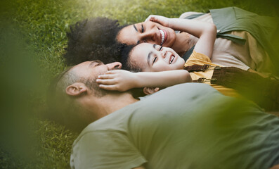 Care, happy and a family lying on the grass in nature for bonding, laughing and comfort. Love,...