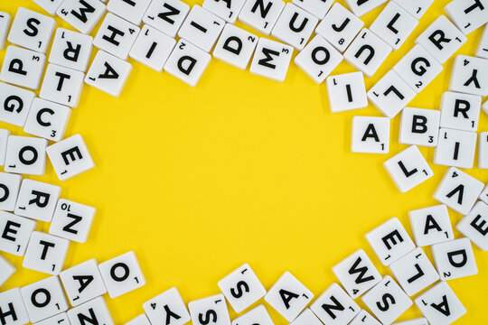 Scrabble game letters yellow background. Ankara, Turkey - August 25, 2023.