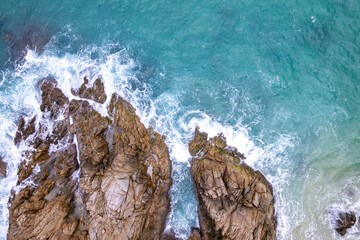 Aerial View Drone shot of waves crashing on seashore, Sea ocean background