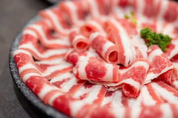 Slice of the fresh raw beef for shabu shabu