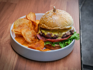 fresh burger close up with potato crisps