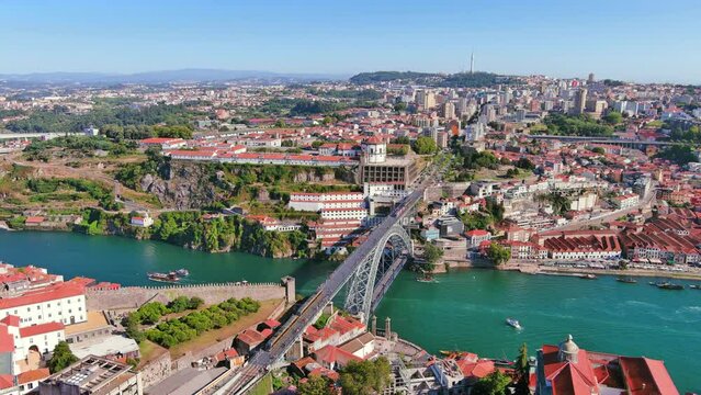 Porto, Portugal: Aerial view of famous European city, center with iconic historic Lu&iacute;s I Bridge (Ponte Lu&iacute;s I) over Douro river, Ribeira district - landscape panorama of Southern Europe from above
