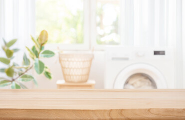 Background for design with empty table on blur laundry room - obrazy, fototapety, plakaty