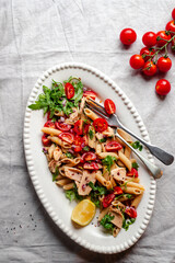 Pasta salad with fresh tomatoes and arugula 