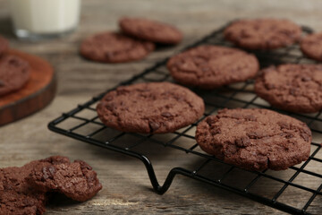 Delicious chocolate chip cookies on wooden table, closeup