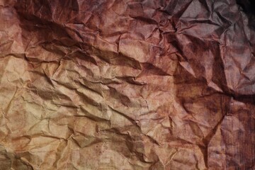 Texture of crumpled parchment paper as background, top view